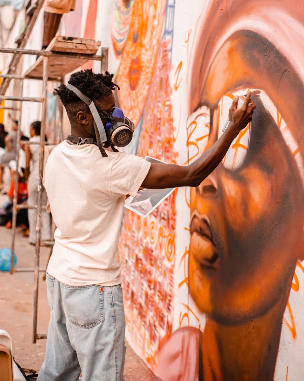 Artisan spray painting mural